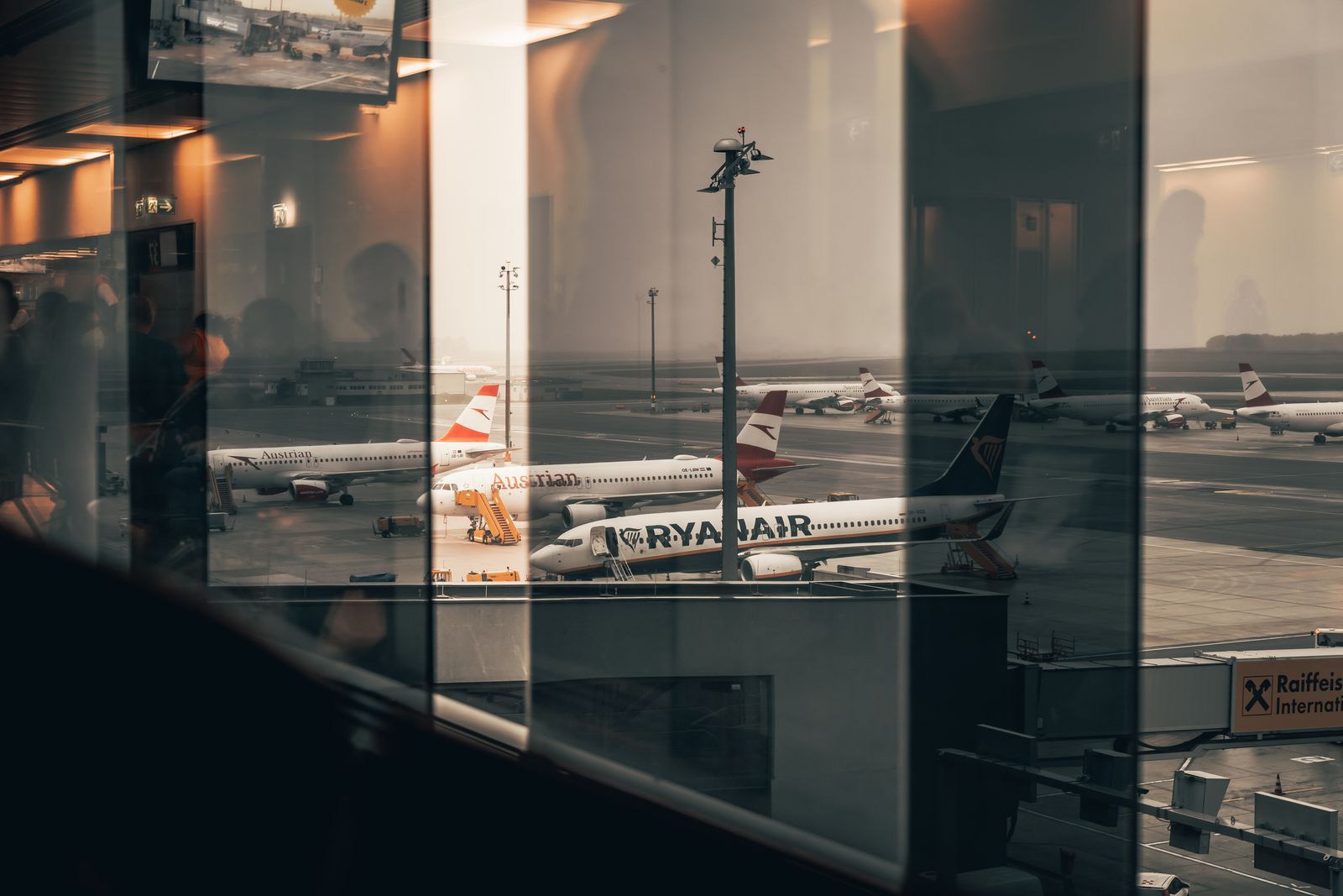 Airplanes outside an airport terminal window