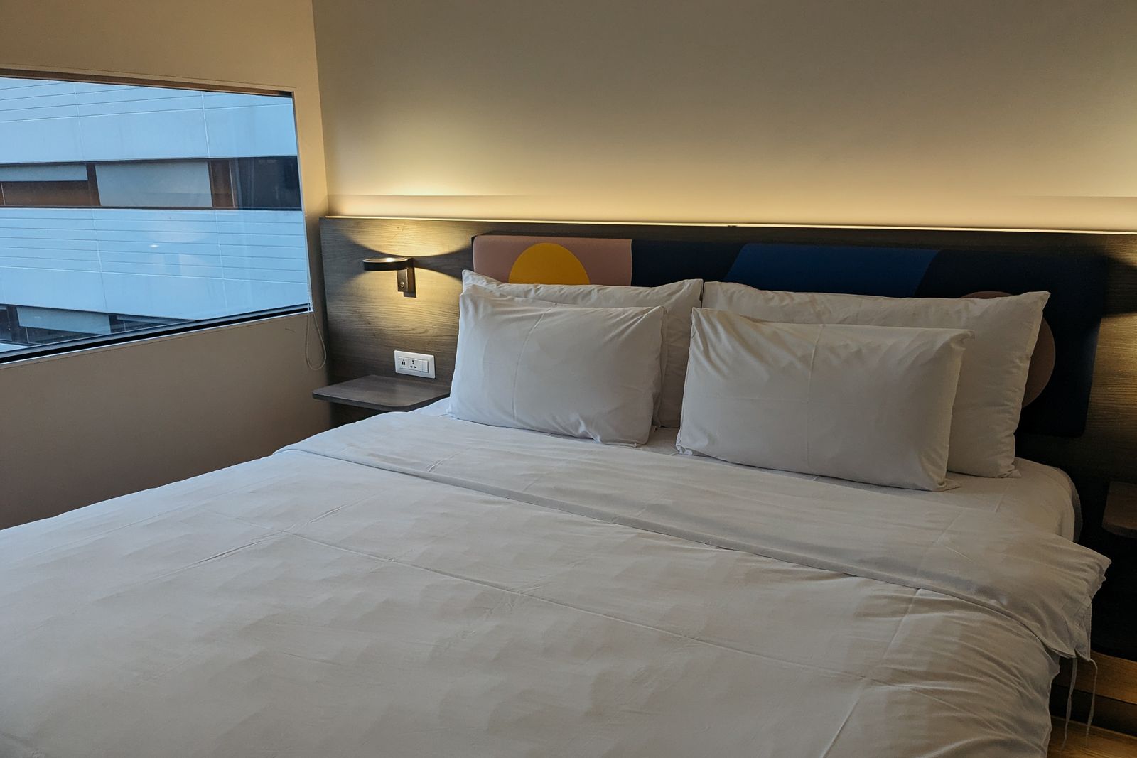 Hotel room with a bed and window